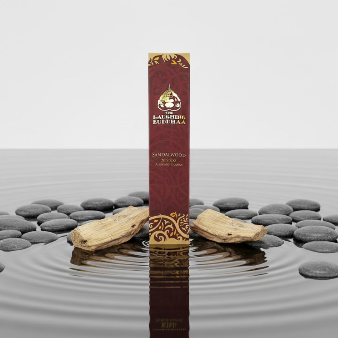 Sandalwood incense stick pack with palo santo wood sticks on water and stones