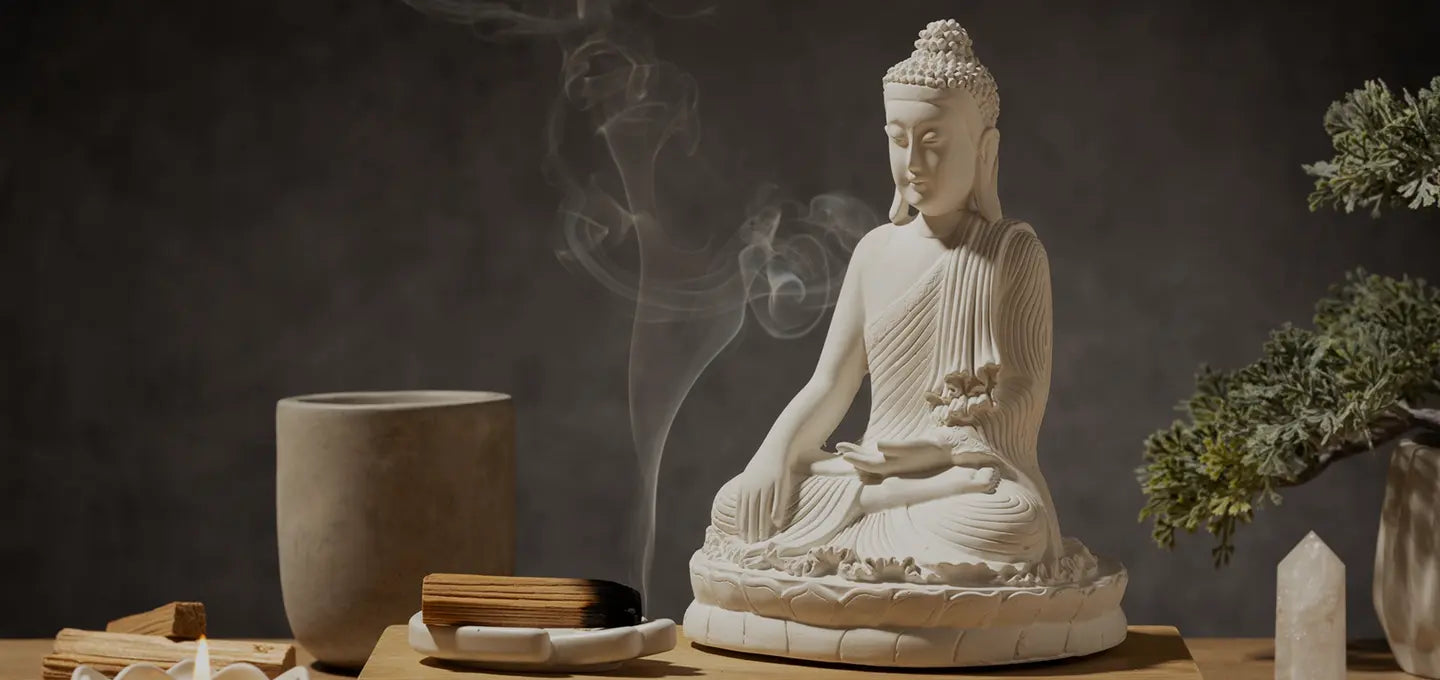 White Buddha statue with incense