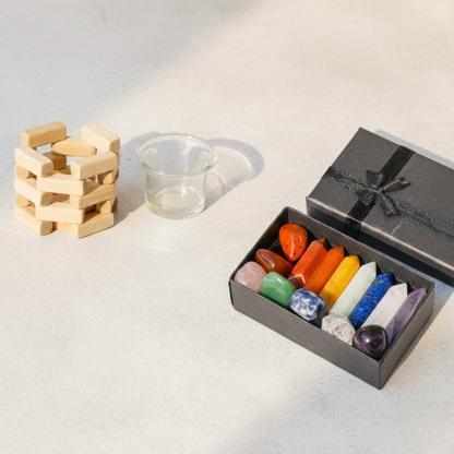 Box of healing crystal and wooden candle holder