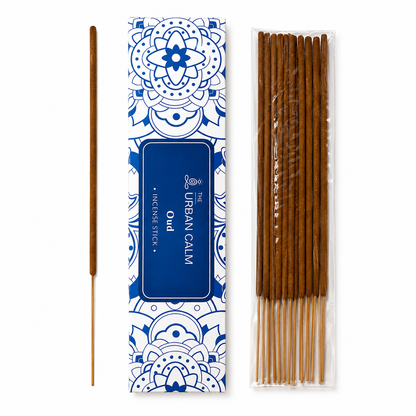 The Urban Calm Oud incense sticks box with single stick — white background