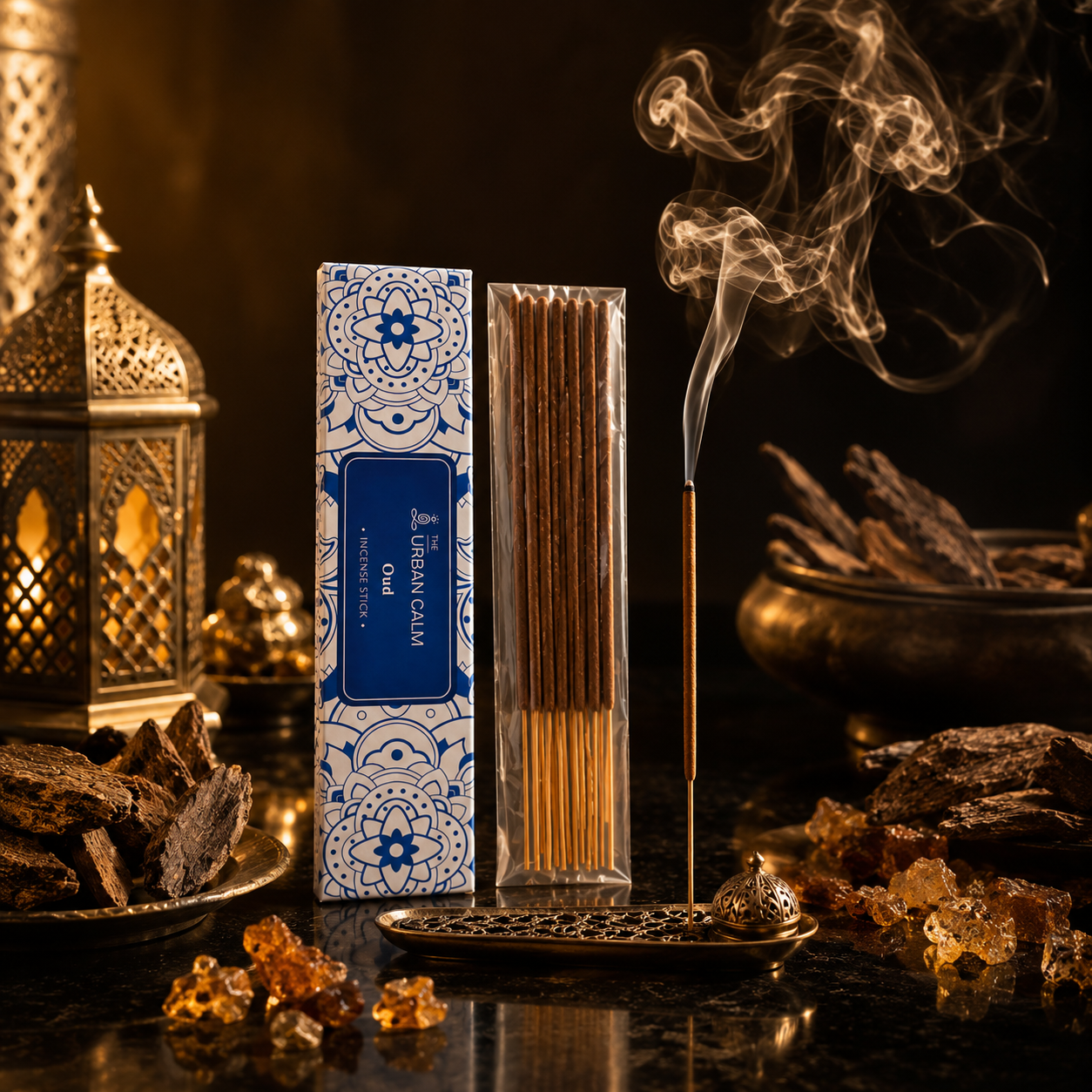 Oud incense with agarwood chunks and resin on a dark surface