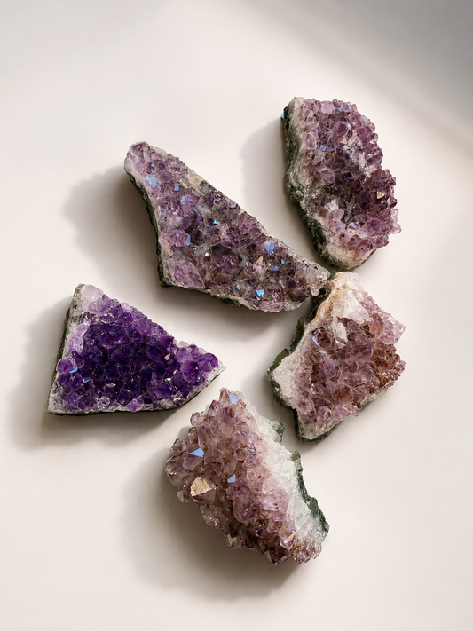 Close-up of raw Amethyst cluster showing pale lavender to deep violet color
