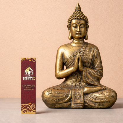 Buddha statue with a box of sandalwood incense