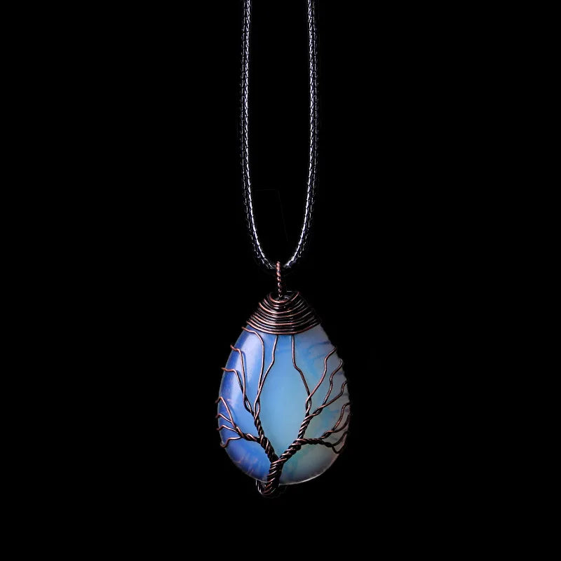 Tree of Life pendant necklace in iridescent blue opal, teardrop shape on a black cord