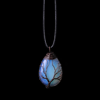 Tree of Life pendant necklace in iridescent blue opal, teardrop shape on a black cord