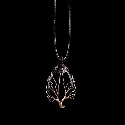 Single Tree of Life gemstone pendant necklace on a cord, showing the copper-toned wire tree wrapped over the stone