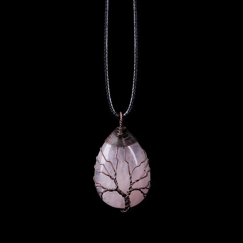 Tree of Life pendant necklace with a pale rose quartz teardrop stone on a black cord
