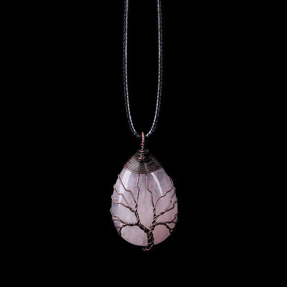 Tree of Life pendant necklace with a pale rose quartz teardrop stone on a black cord